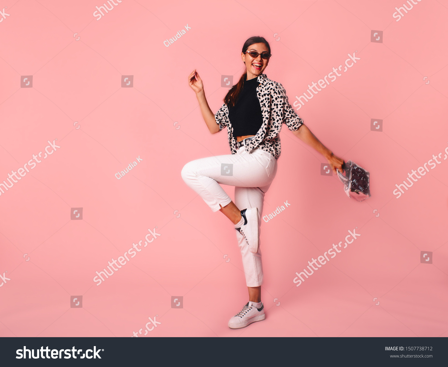 Full Length Portrait of Trendy Hipster Girl Standing at the pink Wall Background. Urban Fashion Concept. Copy Space. #1507738712