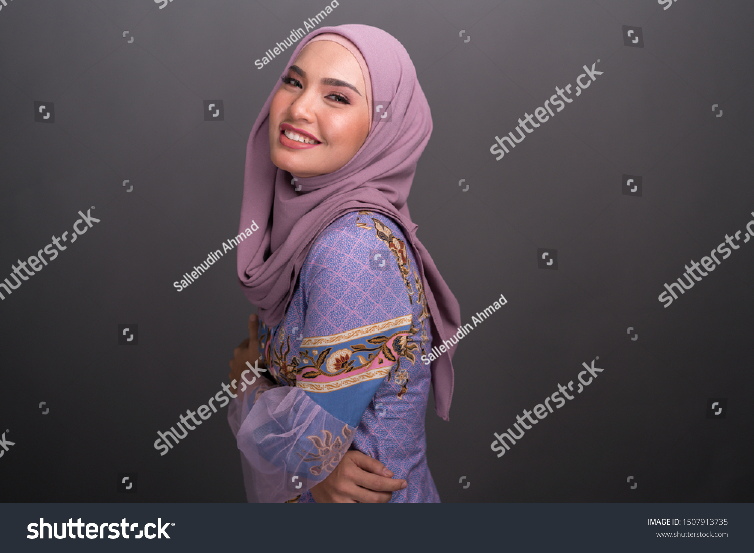 Beautiful female model wearing modern kebaya, an Asian traditional dress for Muslim woman isolated over grey background. Stylish Muslim female hijab fashion lifestyle portraiture concept. #1507913735