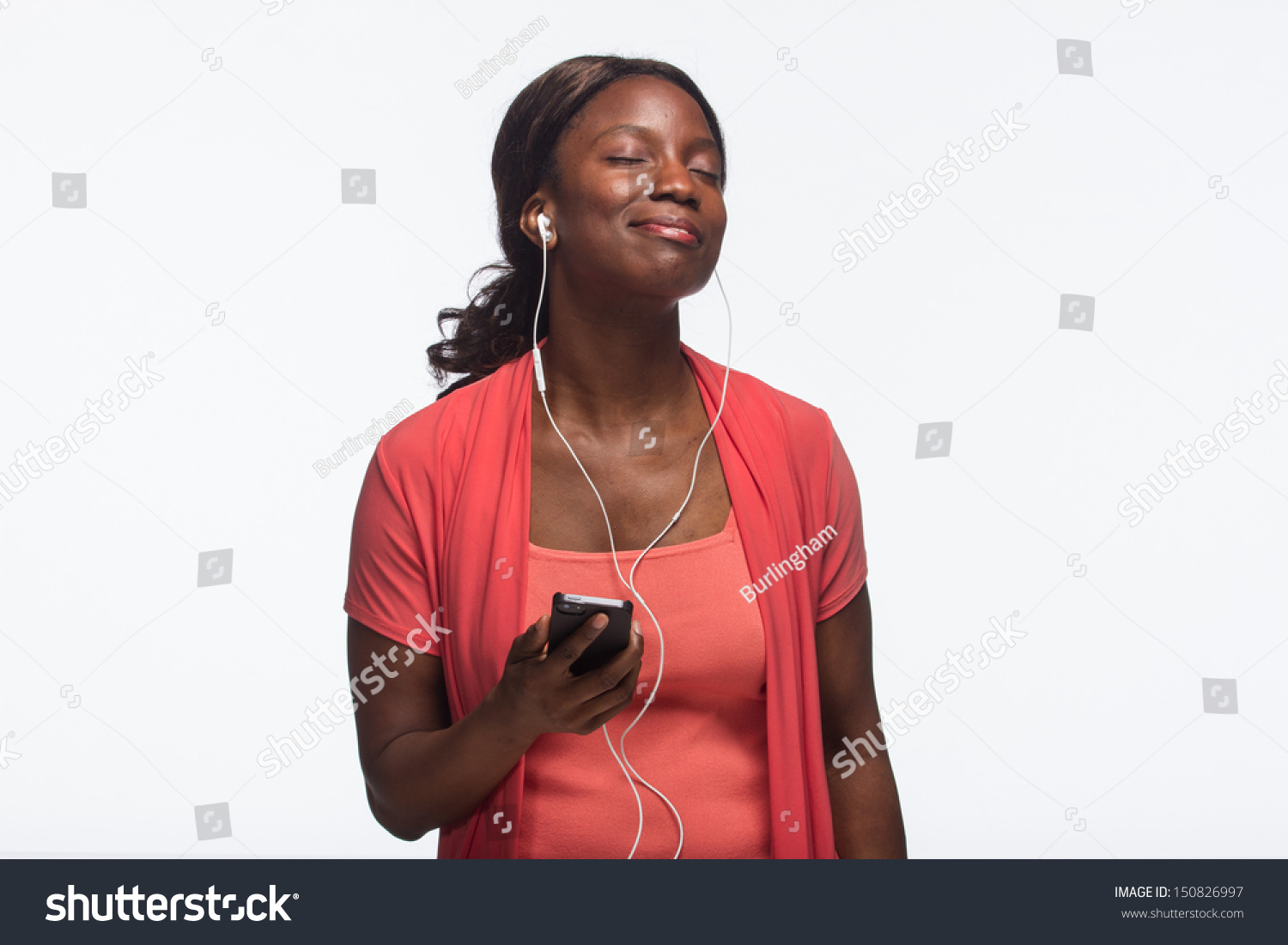 Young African American woman listening to iPod, horizontal #150826997