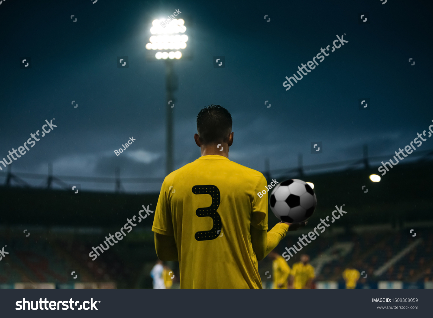 Football player prepare for the game. Soccer player hold the ball in hands #1508808059
