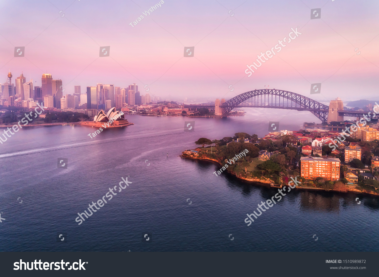 Major landmarks of Sydney city around Sydney harbour and Circular quay across from Kirribilli wealthy suburb on Lower North SHore at sunrise in aerial view. #1510989872