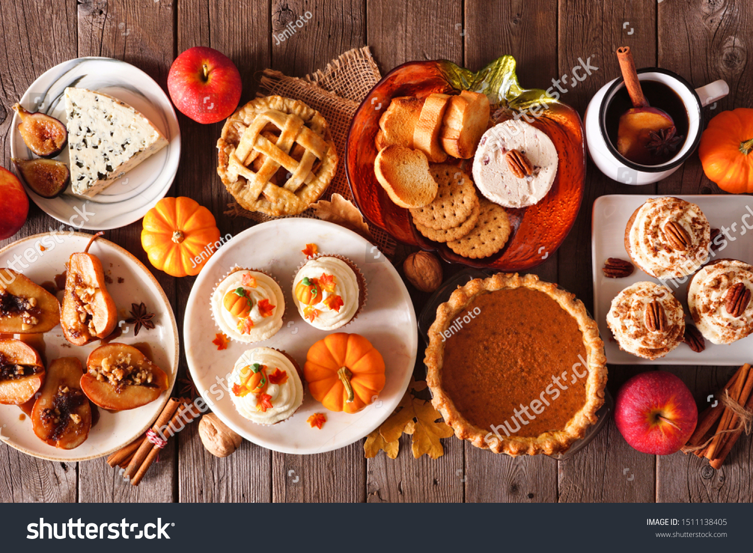 Autumn food concept. Selection of pies, appetizers and desserts. Above view table scene over a rustic wood background. #1511138405