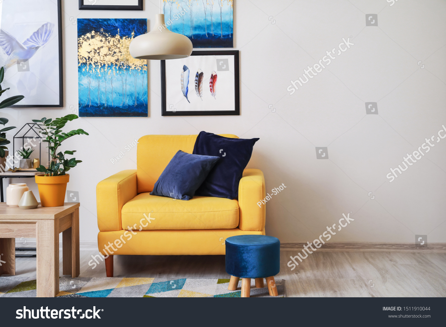 Stylish interior of living room with yellow armchair #1511910044