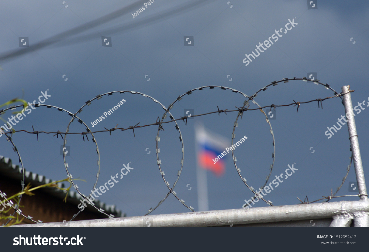 Prison fence with barbed wire in a Russian prison #1512052412