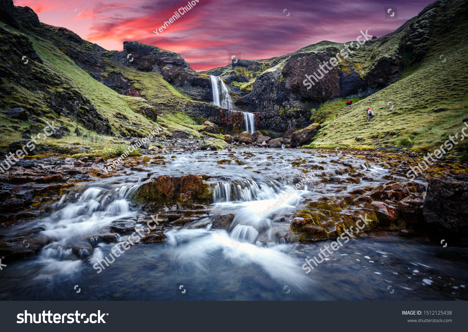 Wonderful nature of Iceland. fresh green grass and icelandic moss near river with waterfall. Typical Icelandic scenery during sunset.  Picture of wild area. Dramatic Scene with colorful sky #1512125438
