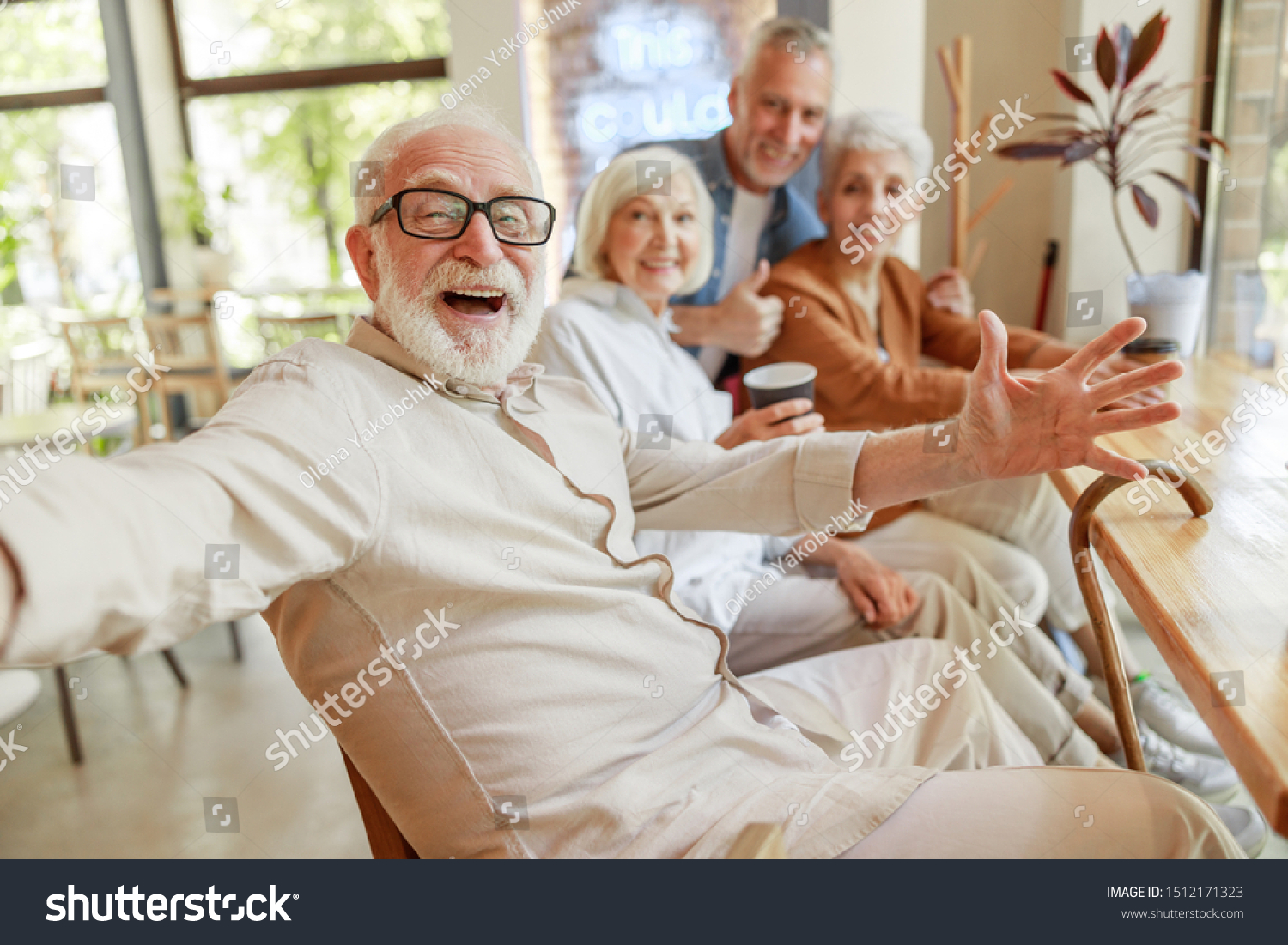Joyful senior man spending time with friends stock photo #1512171323