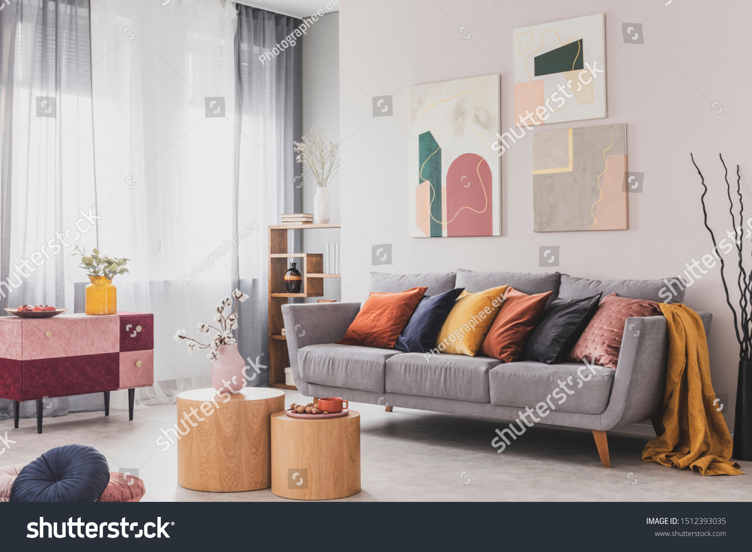 Coffee table in front of grey couch in scandinavian living room #1512393035