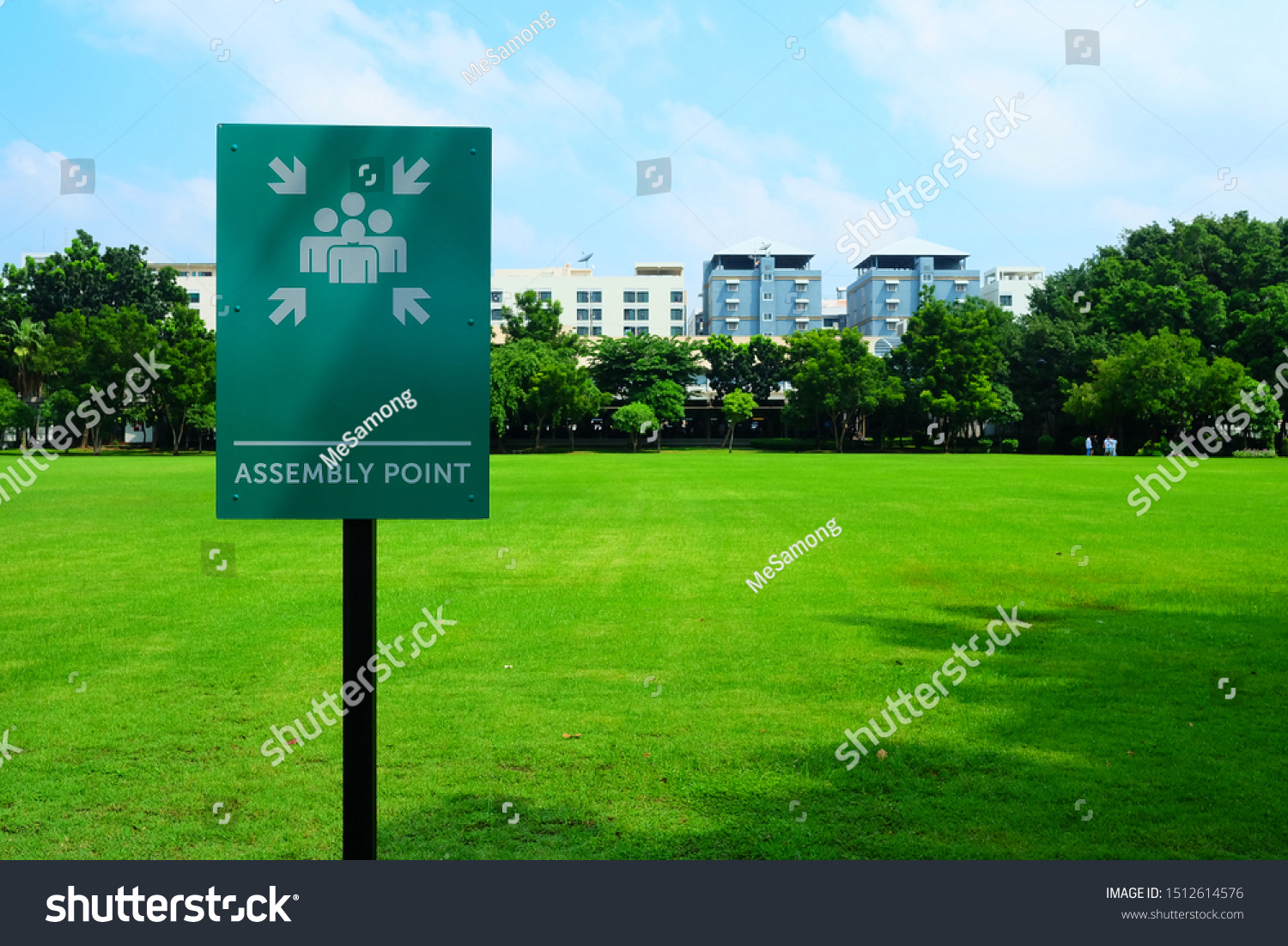 Assembly Point Sign with Green Grass Field Background. #1512614576
