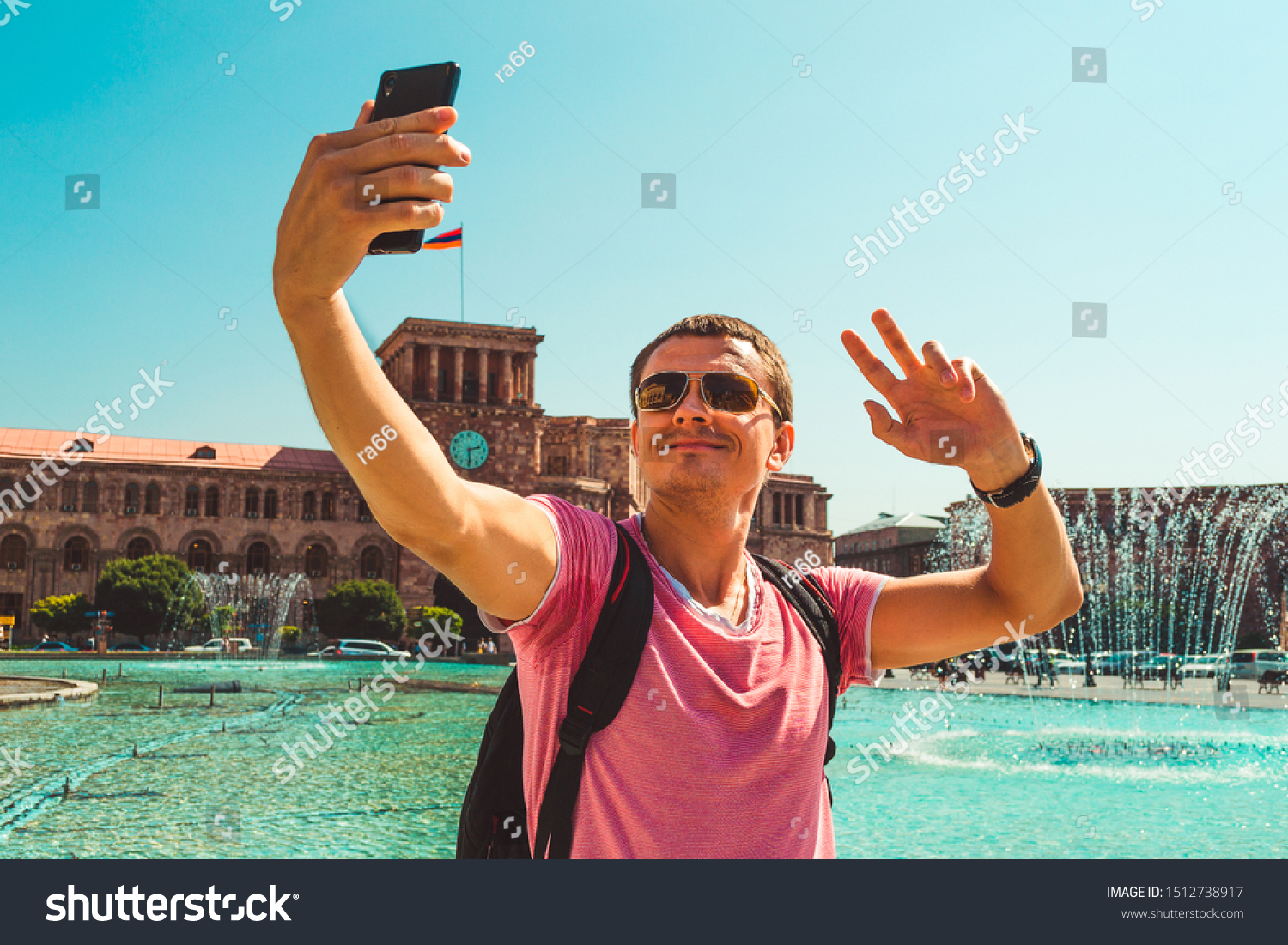 Male tourist with backpack taking selfie on vacation. Caucasian adult man alone explore Armenia. Touristic architecture landmark. Sightseeing Yerevan city tour. Travel and armenian tourism concept. #1512738917