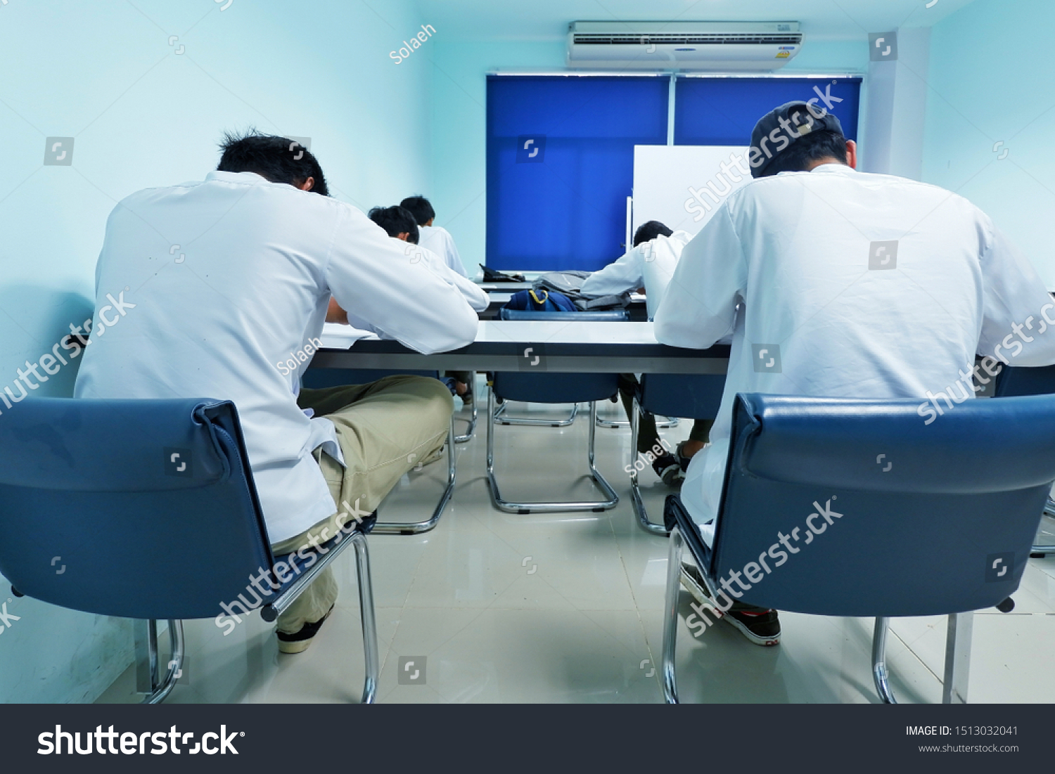 Asian students  Intently taking the examination on the table in the room #1513032041