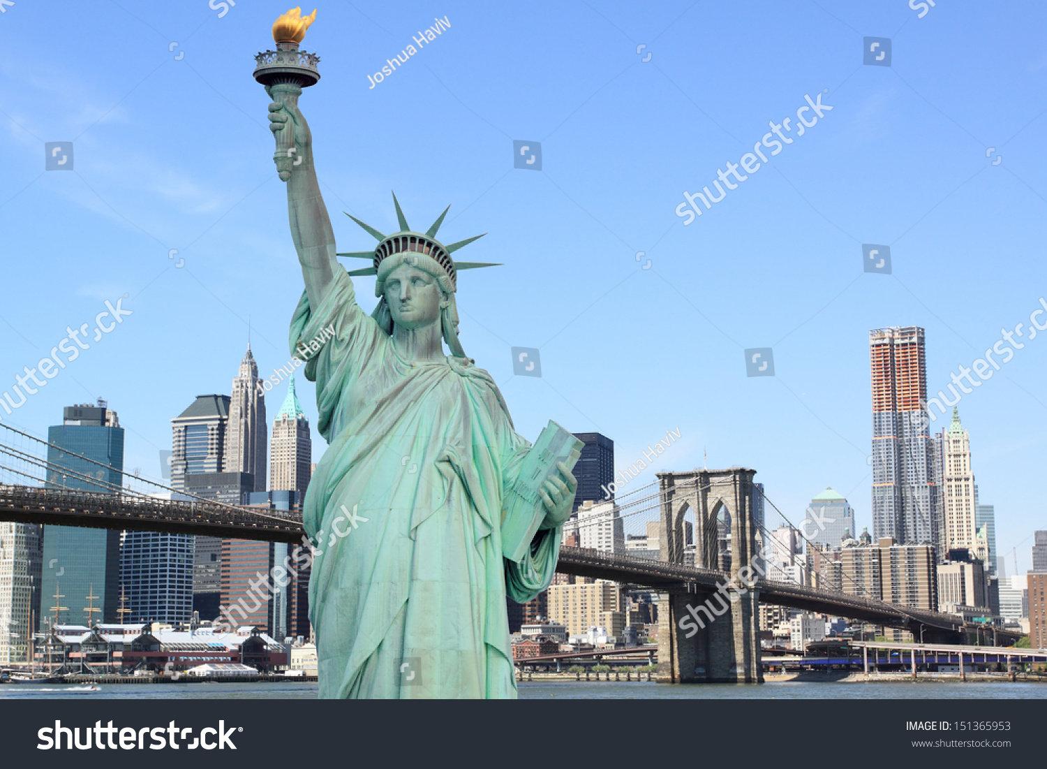 The statue of liberty and Brooklyn Bridge with New York City skyline #151365953
