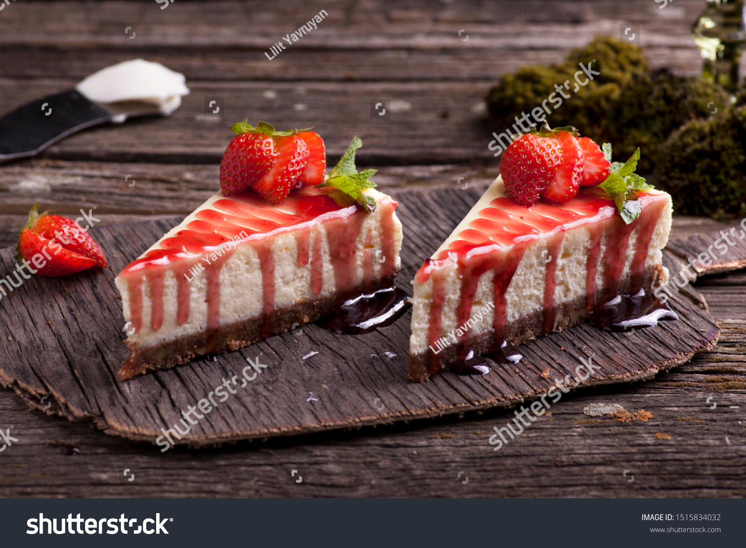 Strawberry cheesecake on wooden exposition  #1515834032