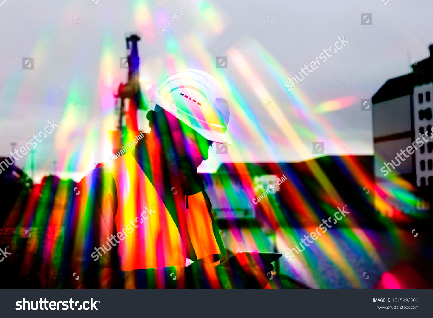 worker with helmet and smart phone and colorful stripes of light #1515990803