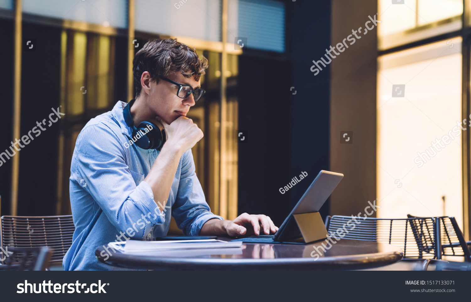 Businessman in formal wear watching online webinar during distance work with startup project on portable pc connected to 4g wireless, male trader in spectacles checking information on website #1517133071
