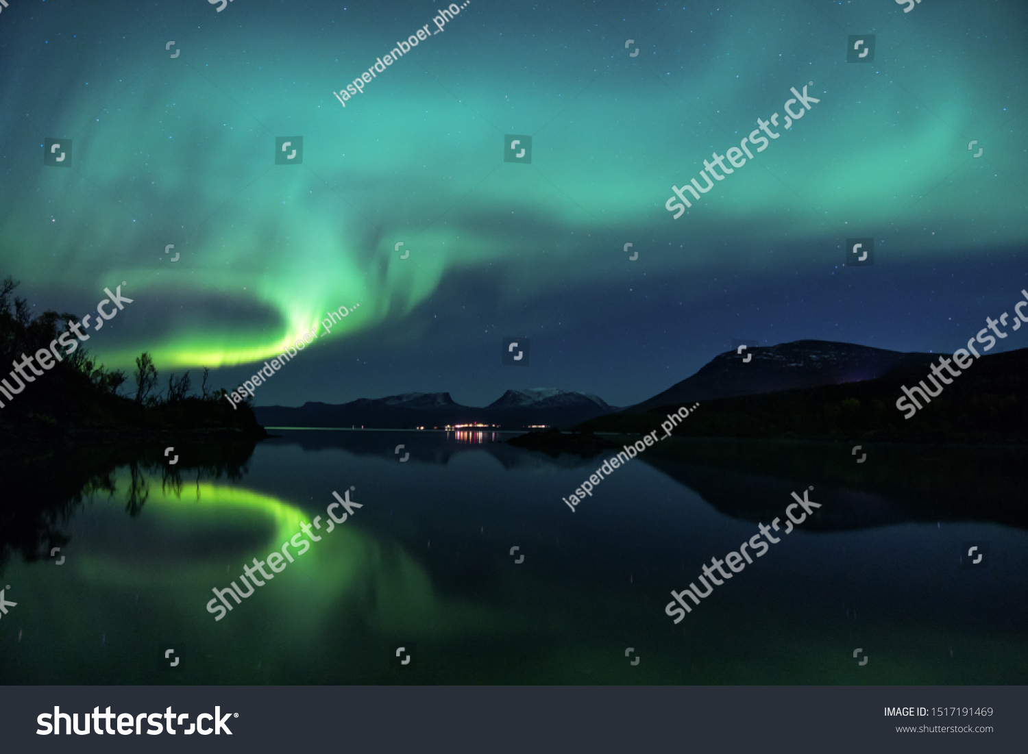 Northern Lights over Abisko National Park in Swedish Lapland. One of the best place to see the Aurora Borealis. Lapporten is also visible in the picture, one of the main symbols of Lapland #1517191469