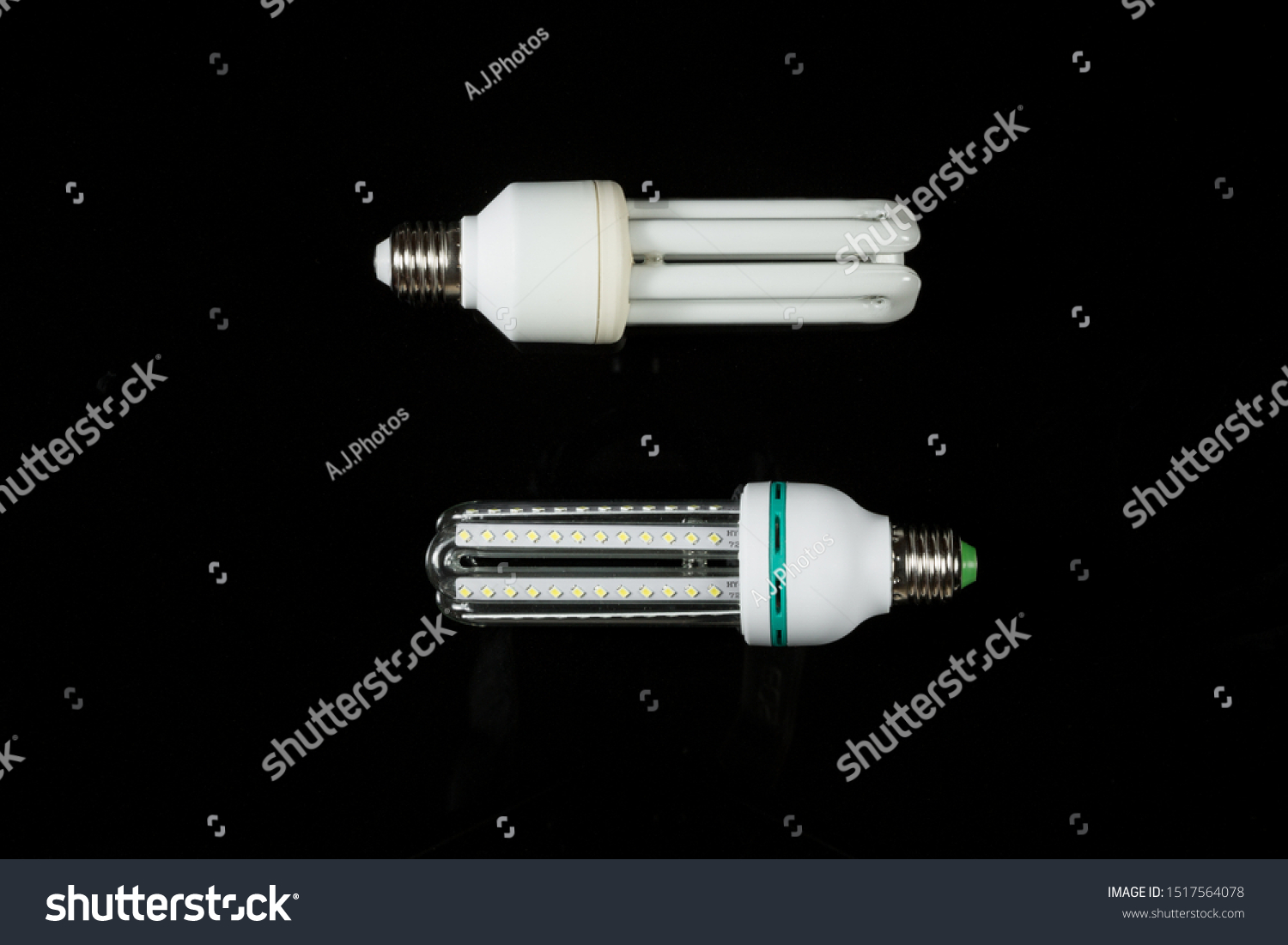 led and fluorescent energy saving lamps on black isolated background. on the glass #1517564078