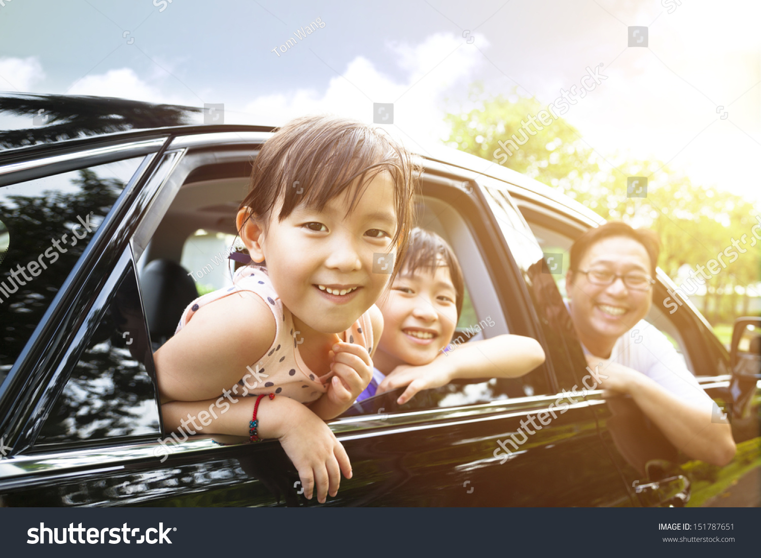 happy little girl with family sitting in the car  #151787651