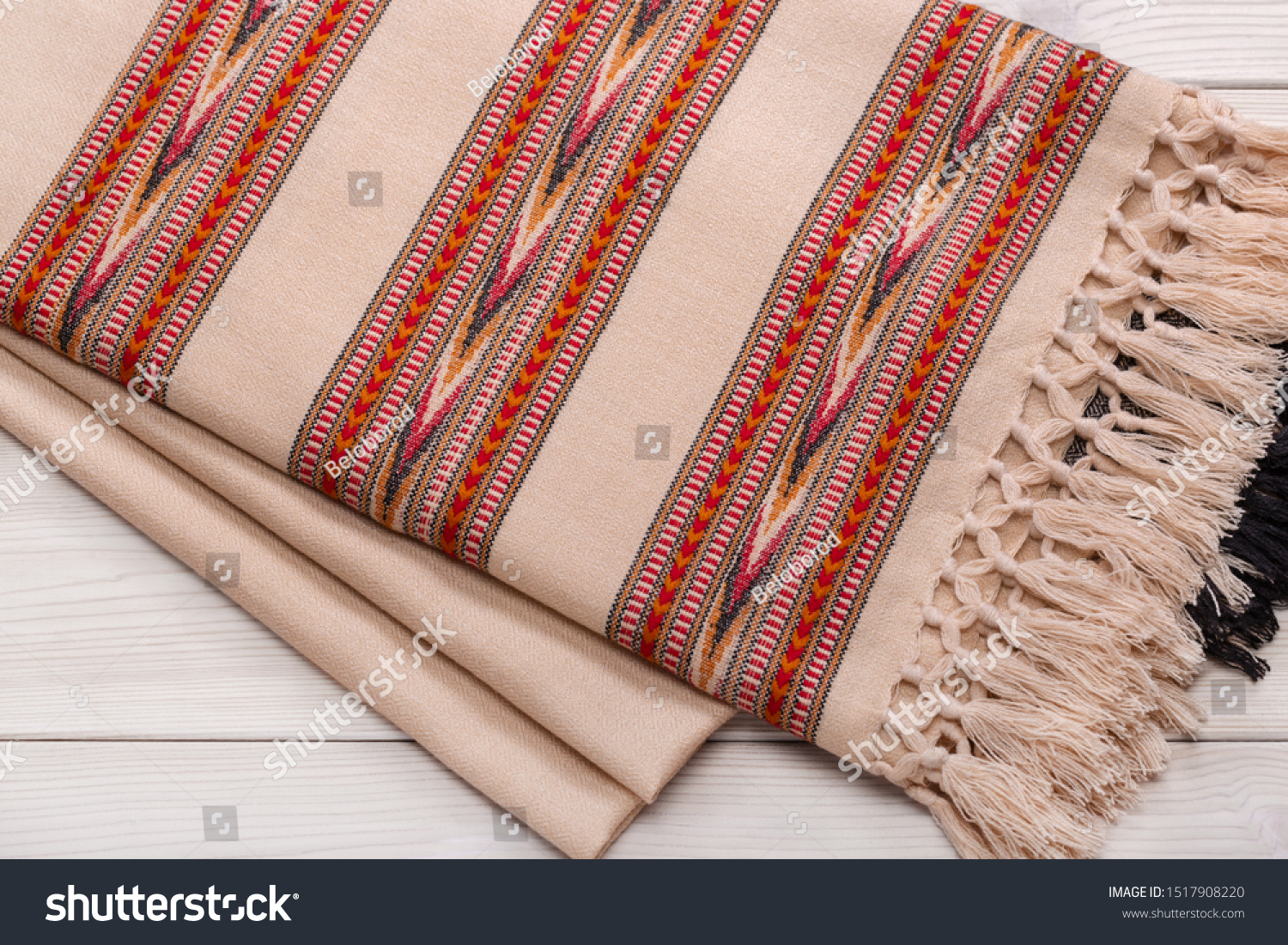  Warm woolen plaid on wooden background. Homeliness. Colorful plaids. #1517908220