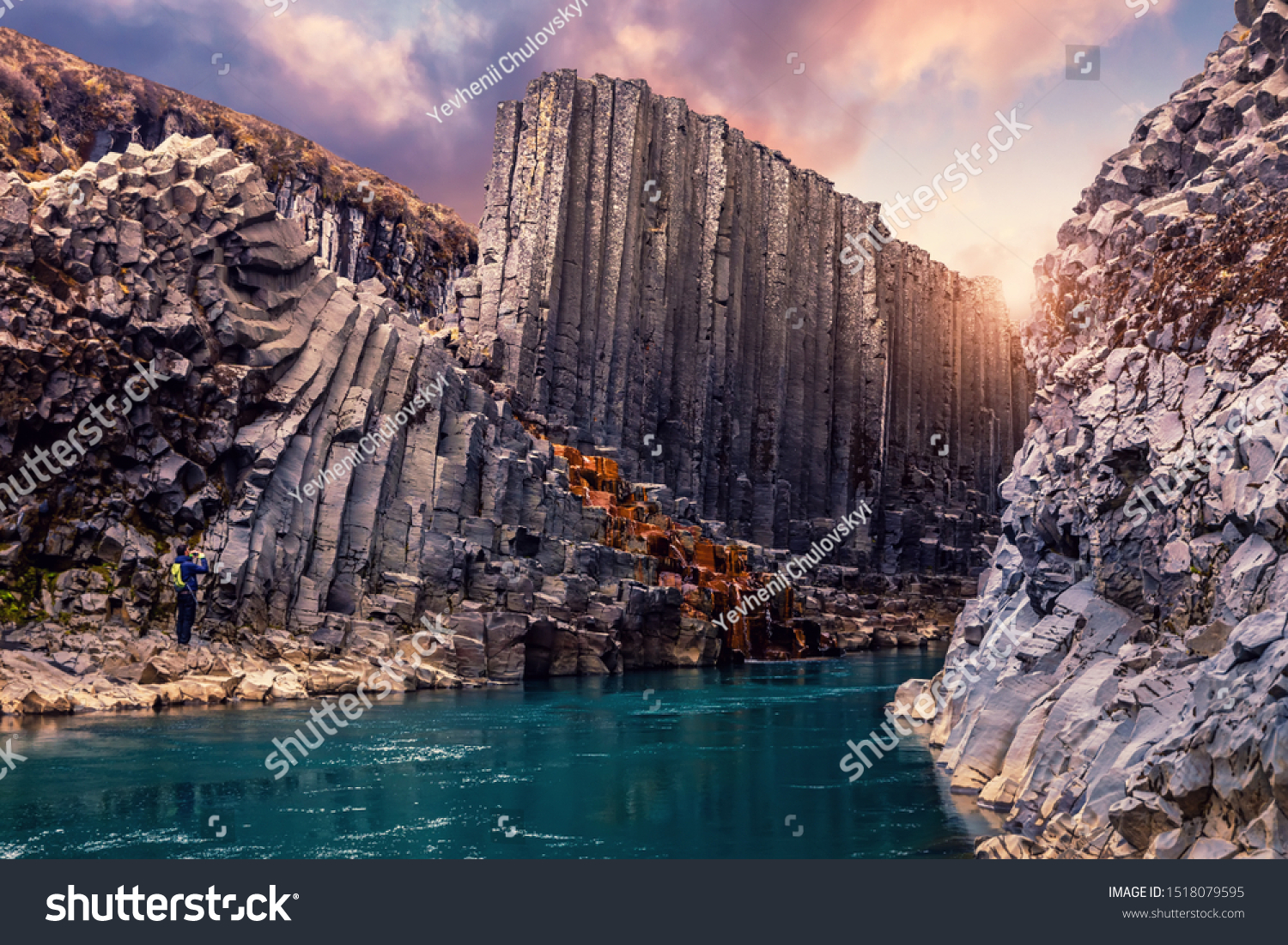 Amazing Nature landscape of Iceland. Impressively beautiful Studlagil canyon with basalt columns and colorful sky during sunset. Tipical Iceland scenery. Iconic location for photographers and bloggers #1518079595