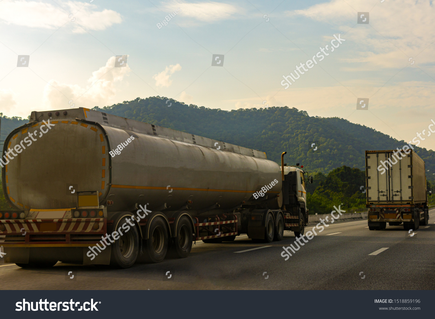 Gas Truck on highway road with tank oil  container, transportation concept.,import,export logistic industrial Transporting Land transport on the asphalt expressway with mountain and sky #1518859196