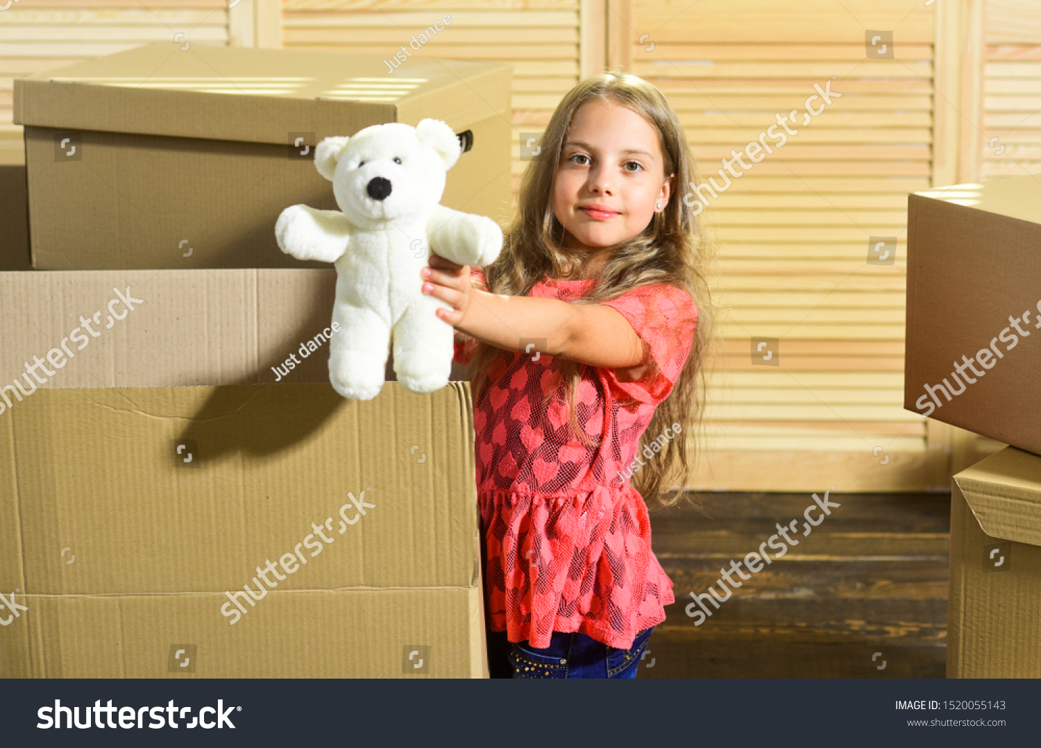 Only true friend. Girl child play with toy near boxes. Move out concept. Prepare for moving. Moving out. Moving routine. Packaging things. Stressful situation. Divorce and separation. Family problem. #1520055143