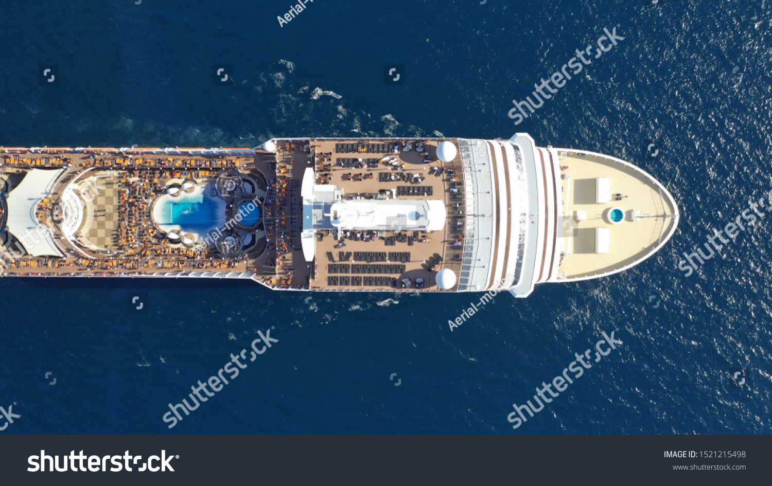 Aerial top view photo of top deck swimming pool in large cruise ship liner crusing in popular destination port #1521215498