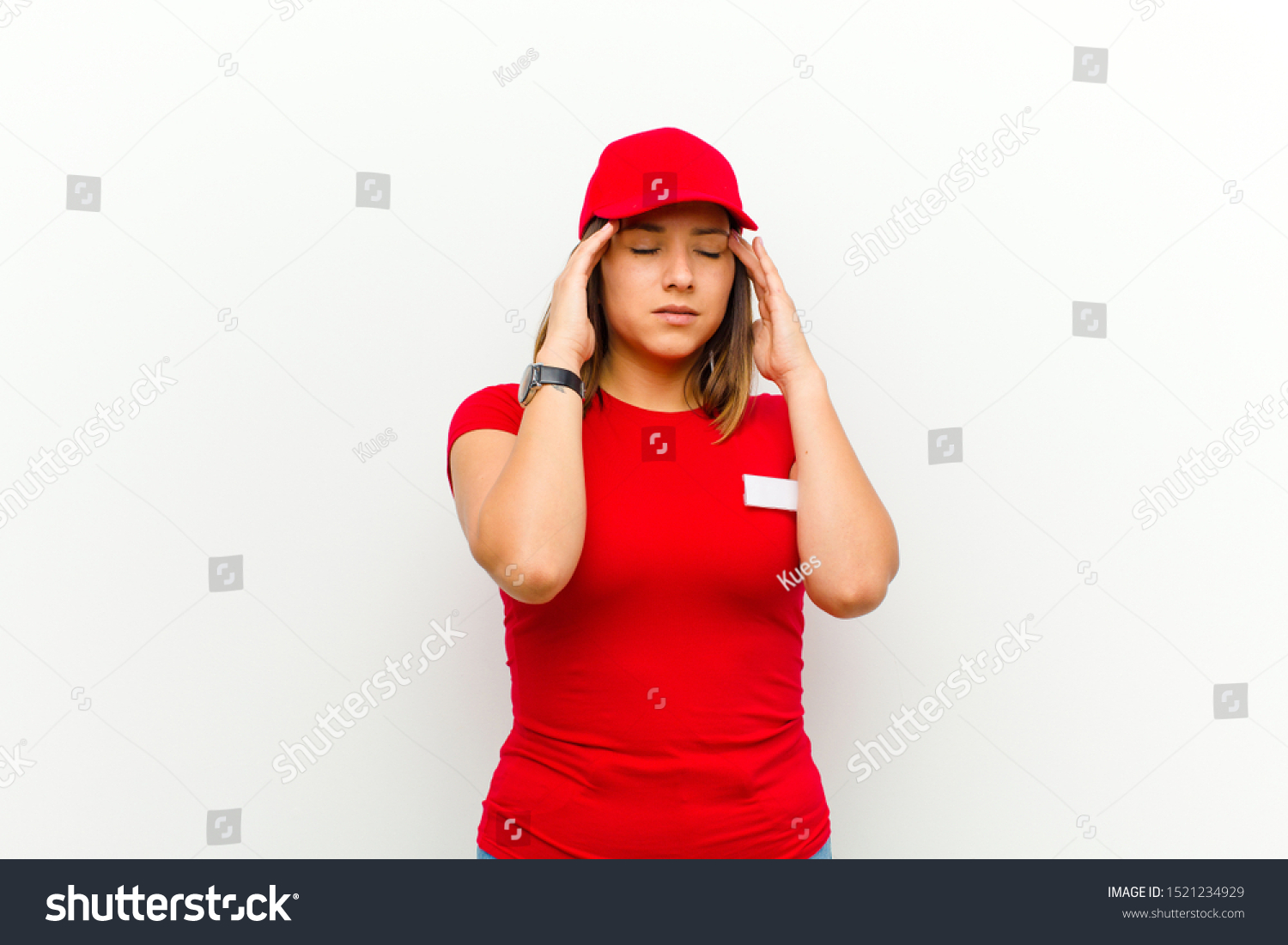 delivery woman looking concentrated, thoughtful and inspired, brainstorming and imagining with hands on forehead against white background #1521234929