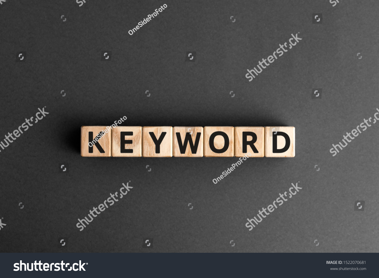 Keyword - word from wooden blocks with letters, search information that contains that word keyword concept, random letters around, white  background #1522070681