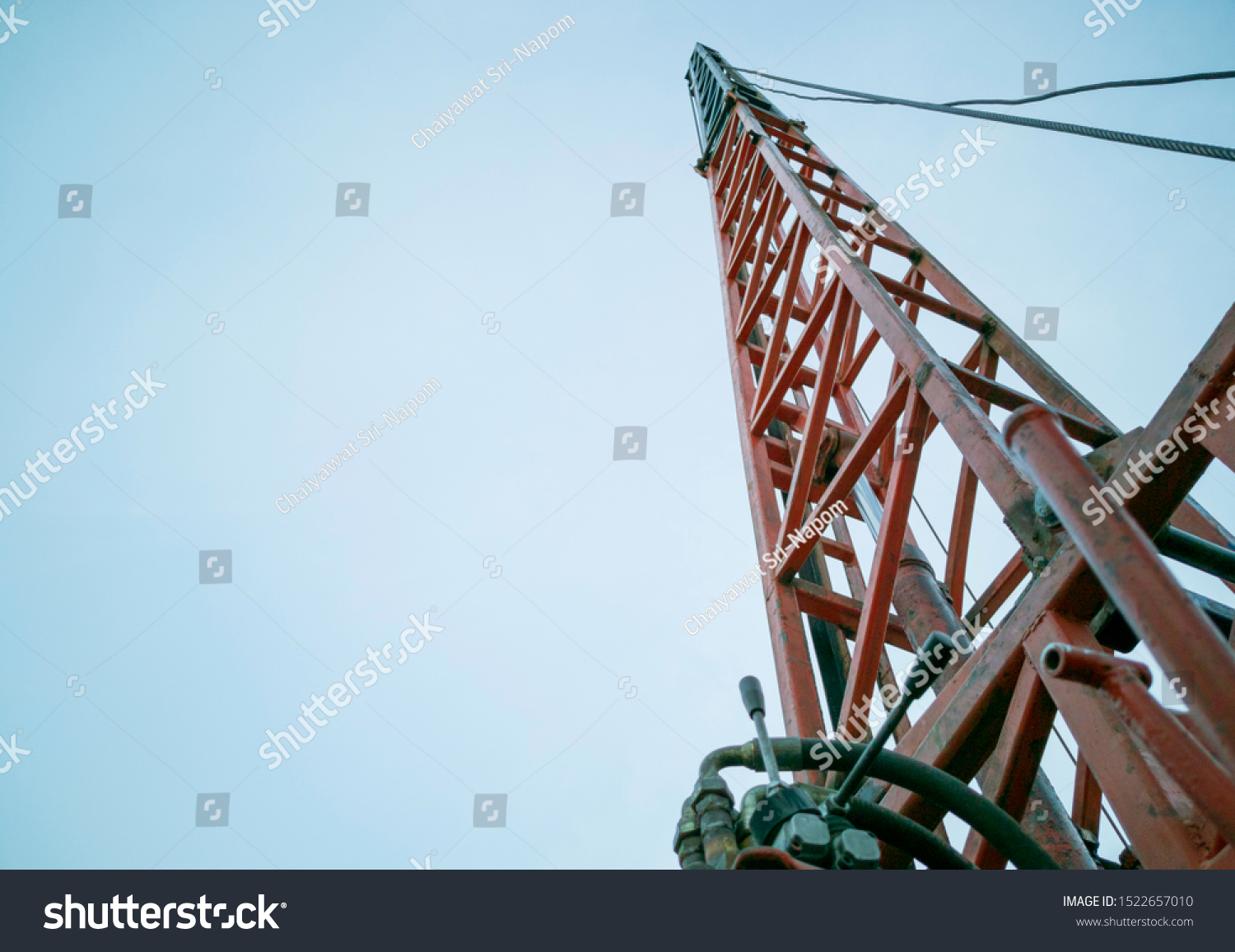 height drop and penatration of pile, pile driving in construction site, piling on blue sky background #1522657010