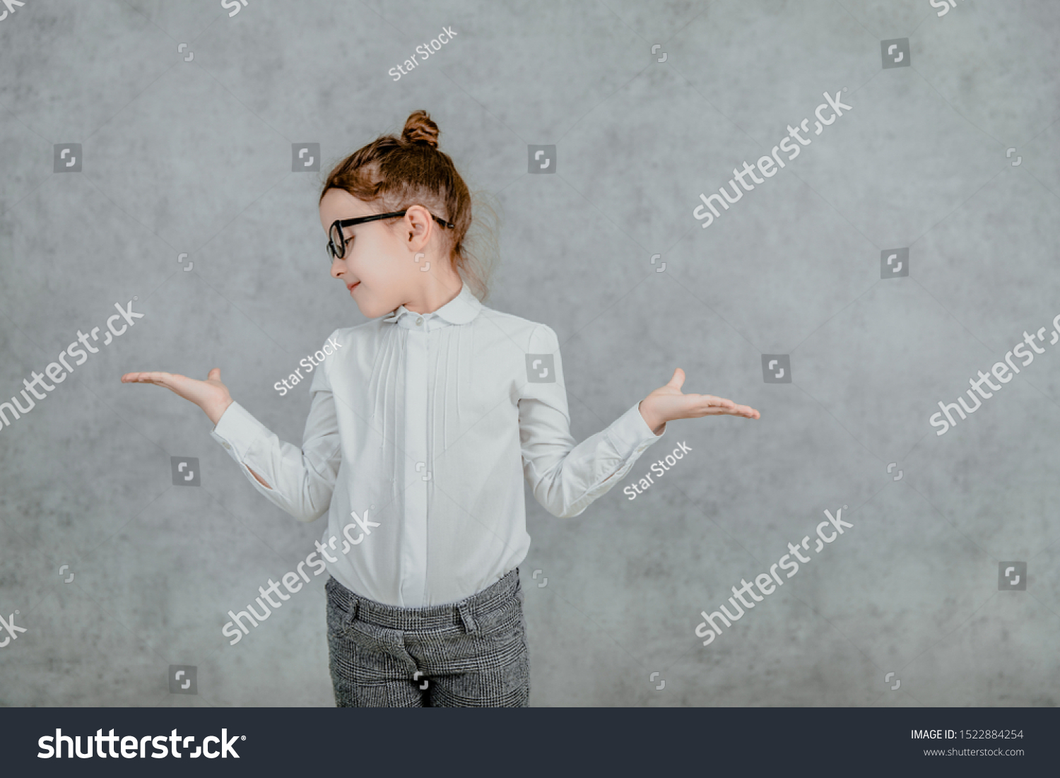 little businesswoman. little businesswoman on yellow background. business lady. little businesswoman with serious and confident look. formal fashion for little businesswoman #1522884254