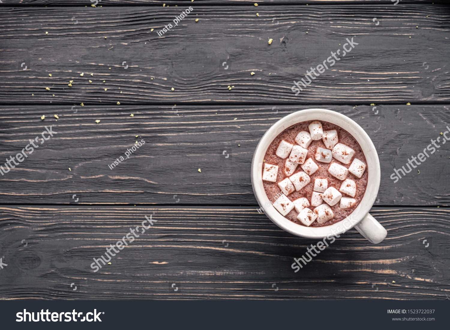Cocoa chocolate cup with hot drink and white marshmallow on wood desk cozy background, cacao in mug on brown wooden rustic table, holiday coffee house shop, above top overhead view, copy space #1523722037