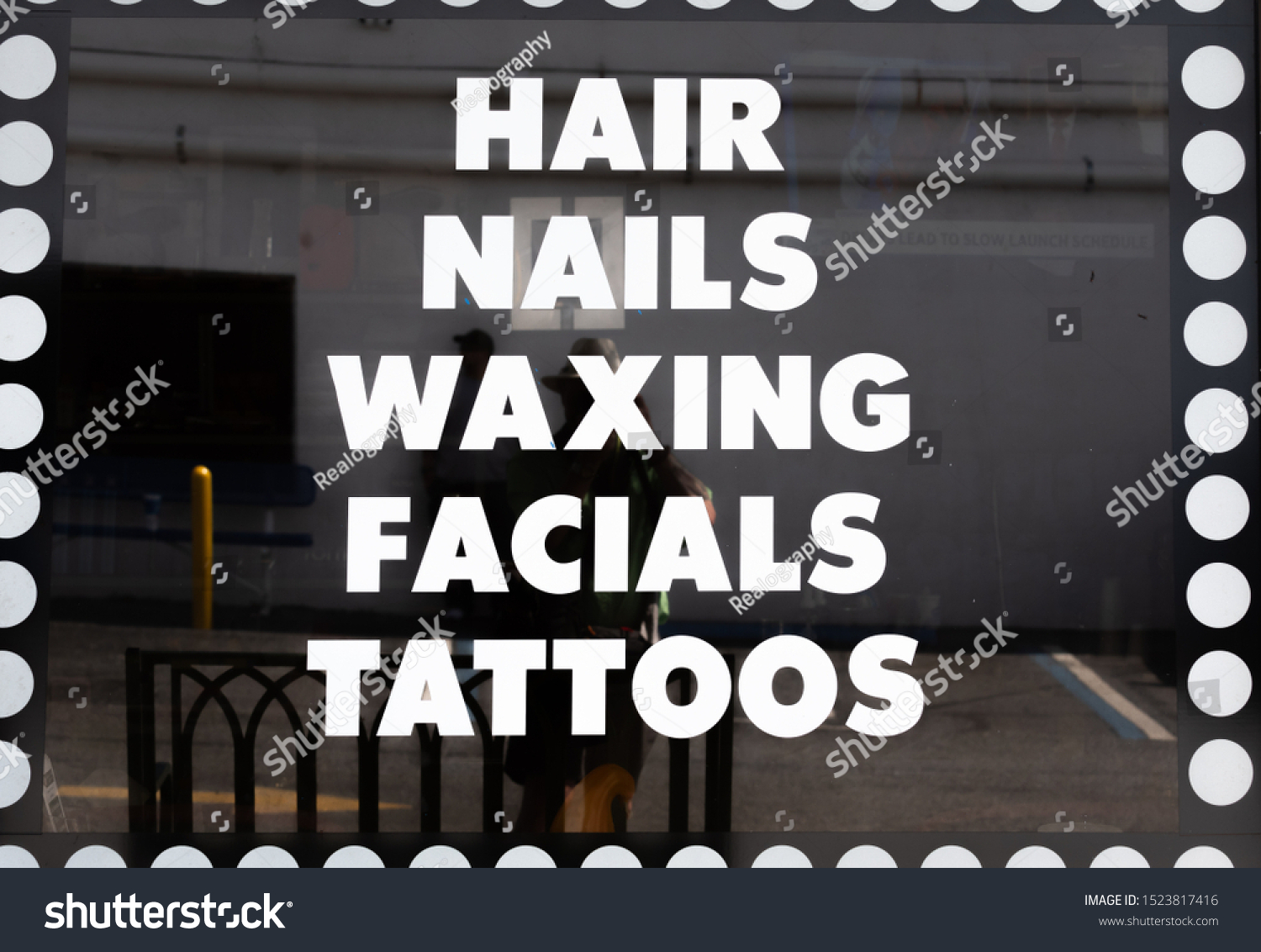 sign that says hair, nails, waxing, facials, tatoos #1523817416