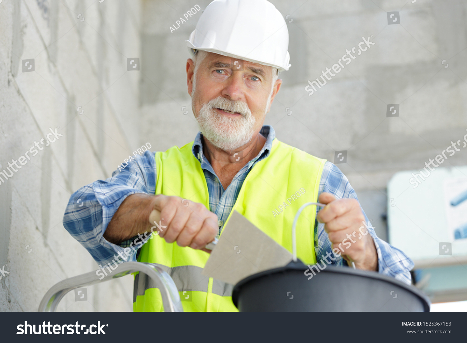 a senior builder with spatula #1525367153