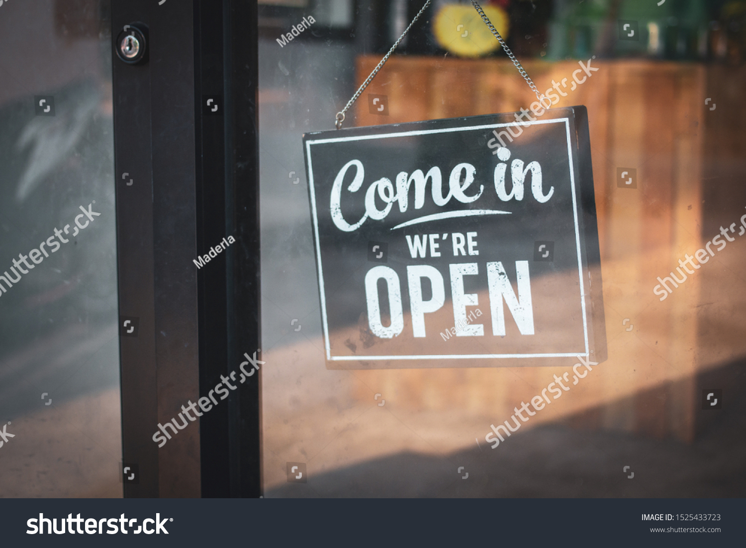 A business sign that says 'Come in We're Open'. #1525433723