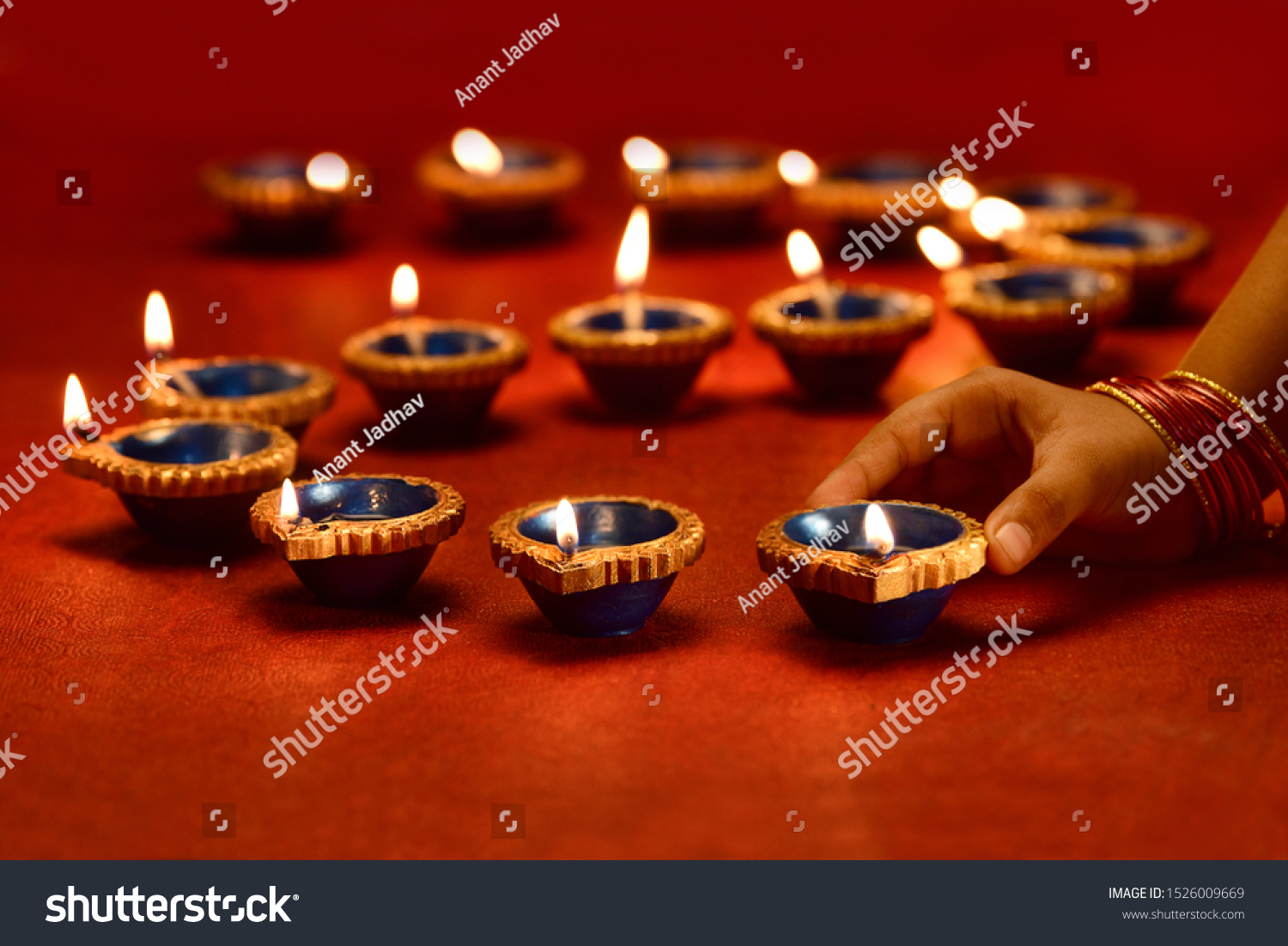 Diwali lamp lit by hand, Diwali Lamps , Diwali diya lamps lit during diwali celebration #1526009669