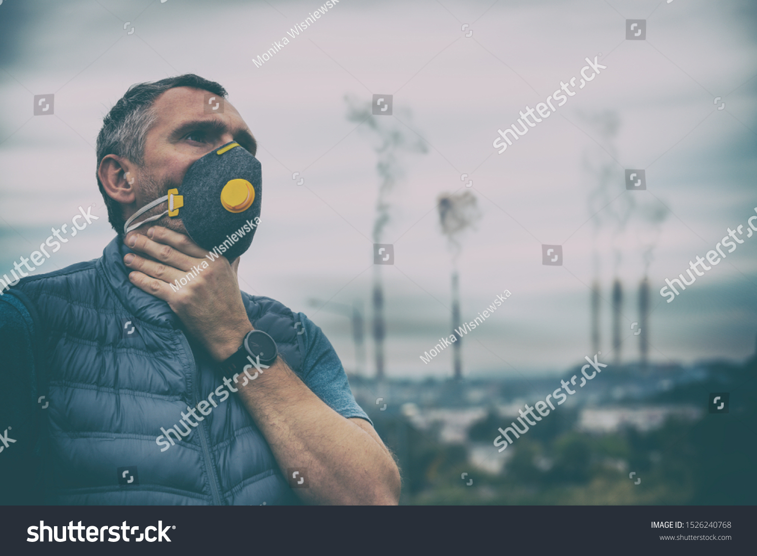 Man wearing a real anti-pollution, anti-smog and viruses face mask; dense smog in air. #1526240768