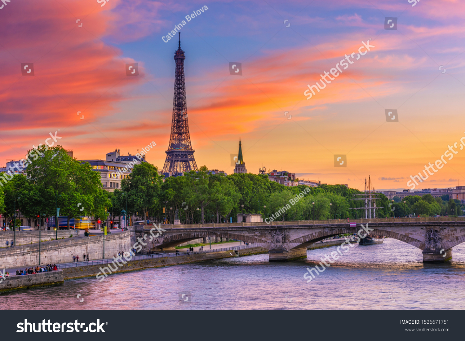 Sunset view of Eiffel tower and Seine river in Paris, France. Eiffel Tower is one of the most iconic landmarks of Paris. Cityscape of Paris #1526671751