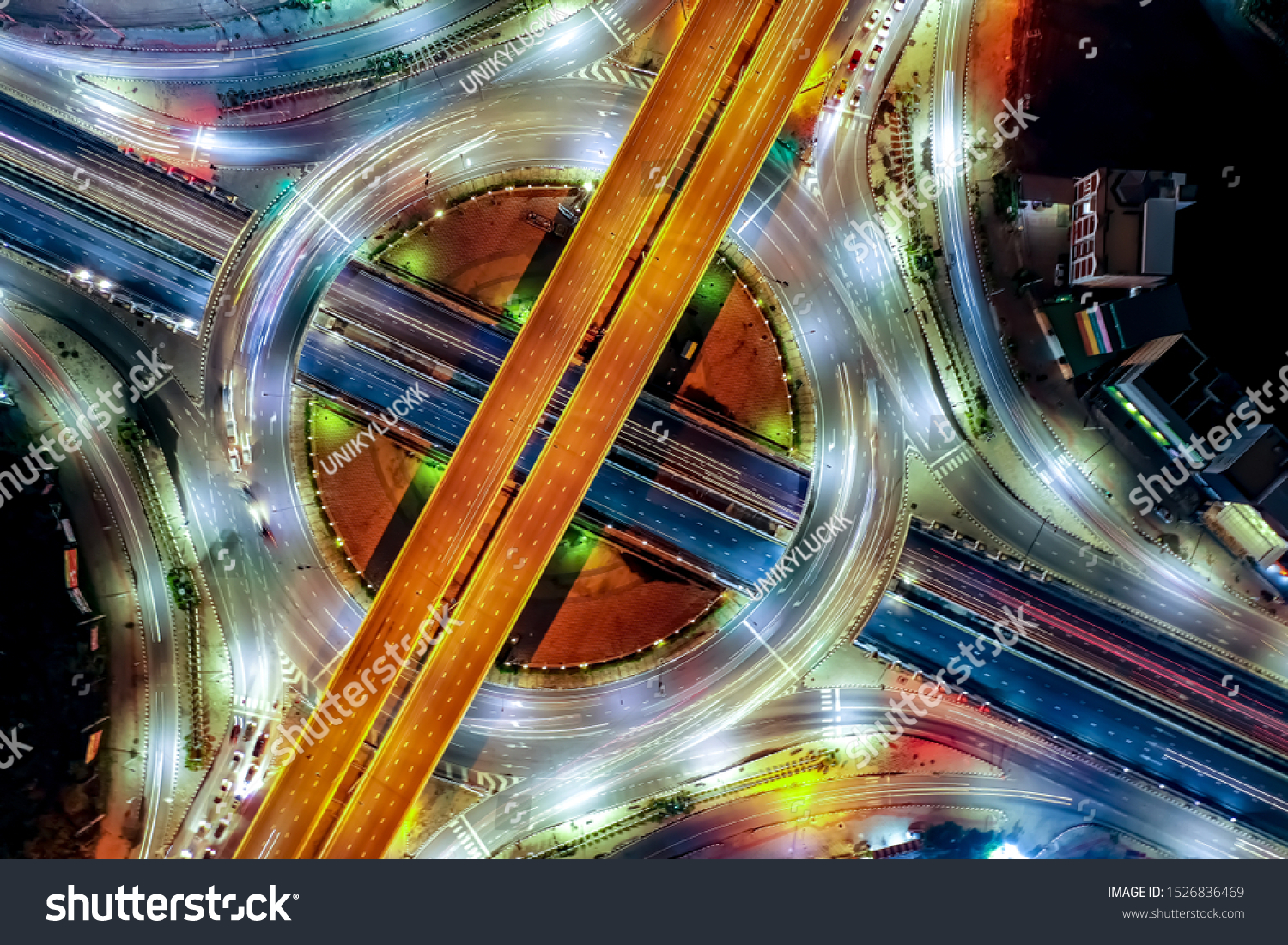 Aerial top view of smart modern transportation with Expressway, Road and Roundabout, busy highway traffic night time. Important infrastructure. Traffic center. For abstract background. #1526836469