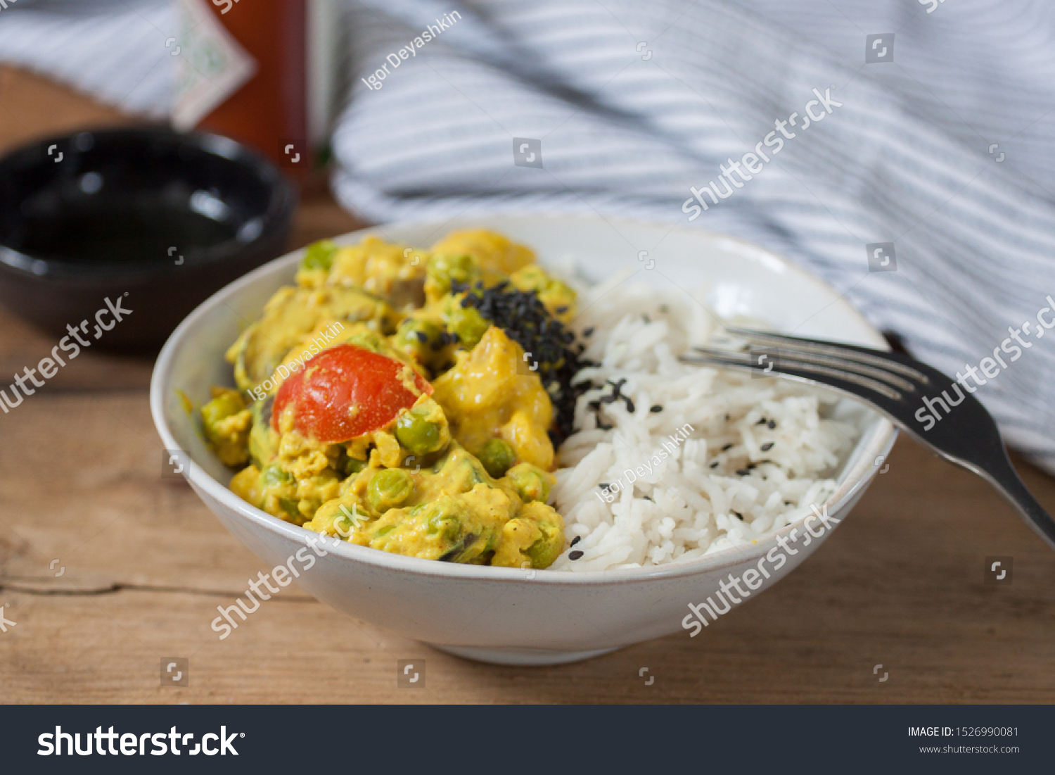 White bowl with basmati rice and vegan curry with peas and tomato #1526990081