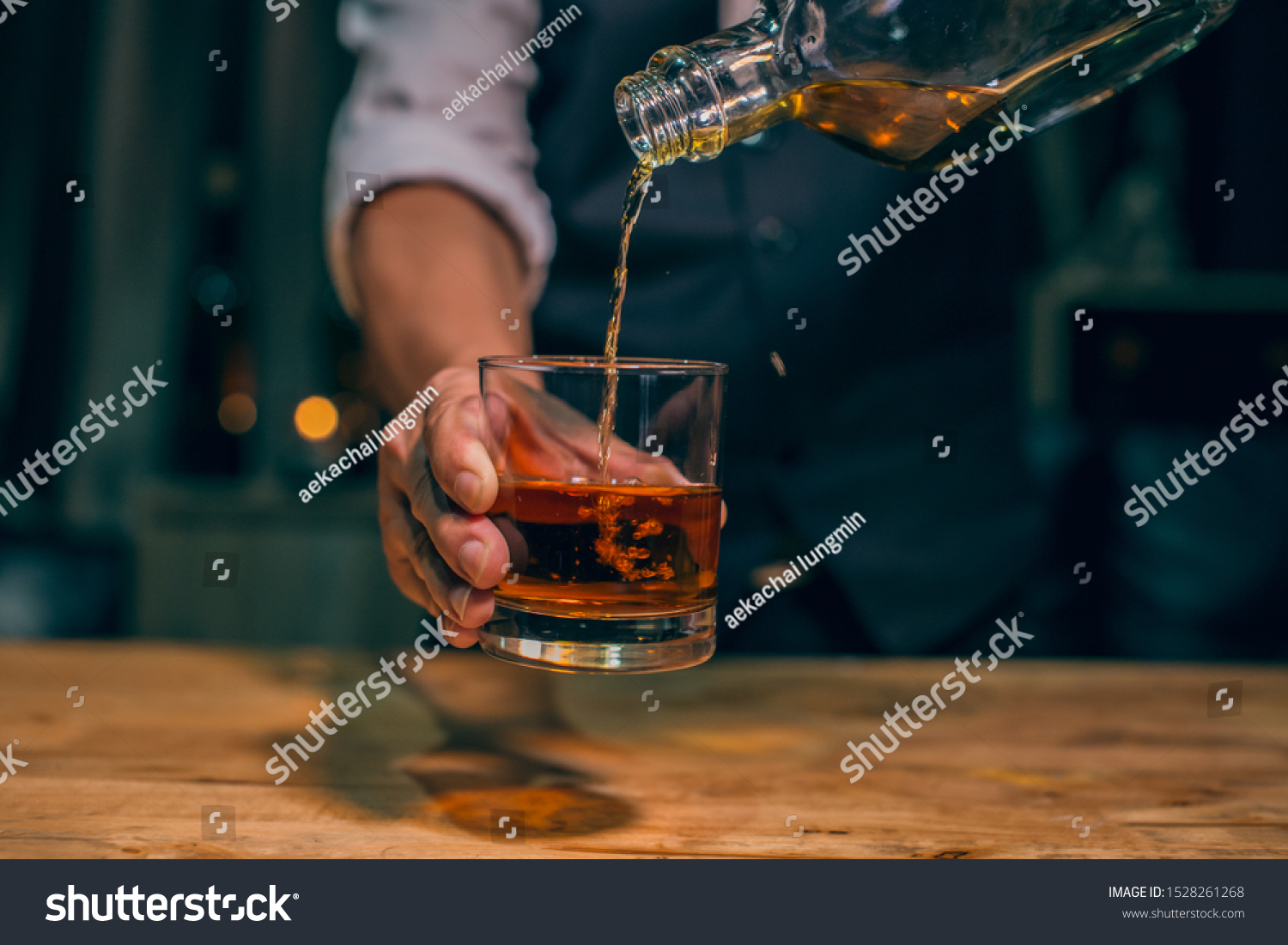 Barman pouring whiskey whiskey glass beautiful night #1528261268