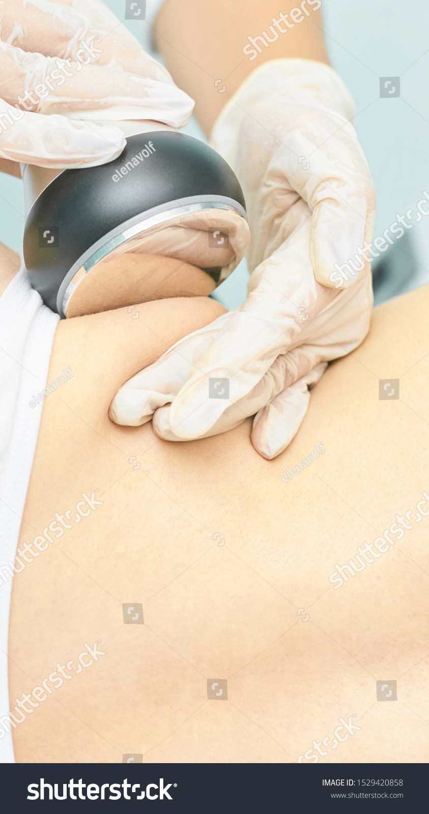 Cavitation rf body treatment. Female ultra sound lipo machine. Spa contouring. Doctor hands. #1529420858
