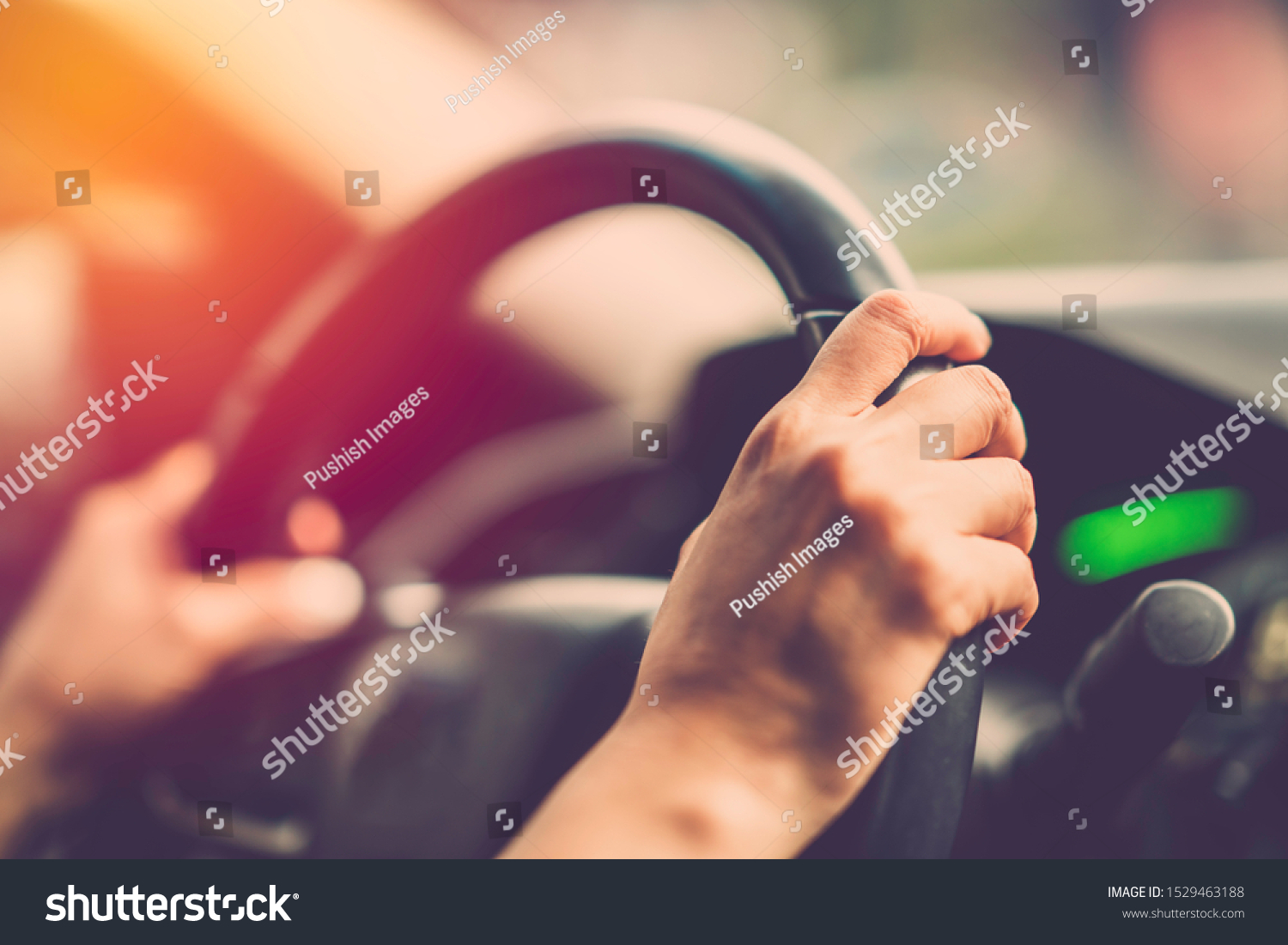 Woman hand driving car. Vintage filter #1529463188