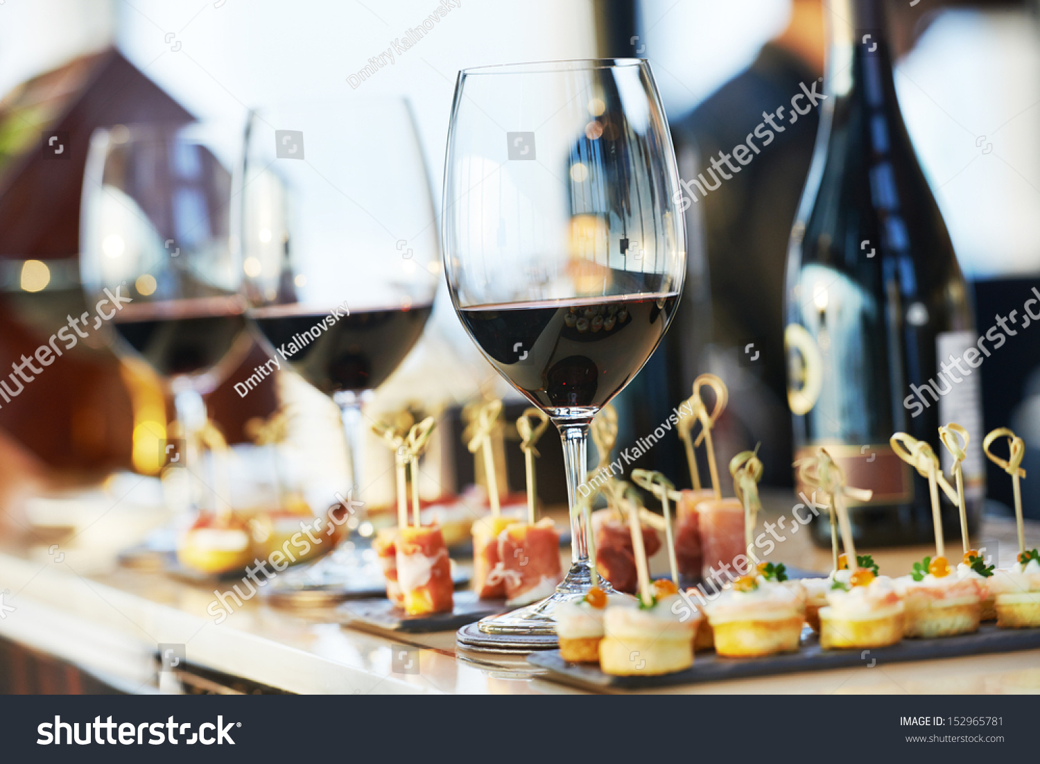 catering services background with snacks and glasses of wine on bartender counter in restaurant #152965781