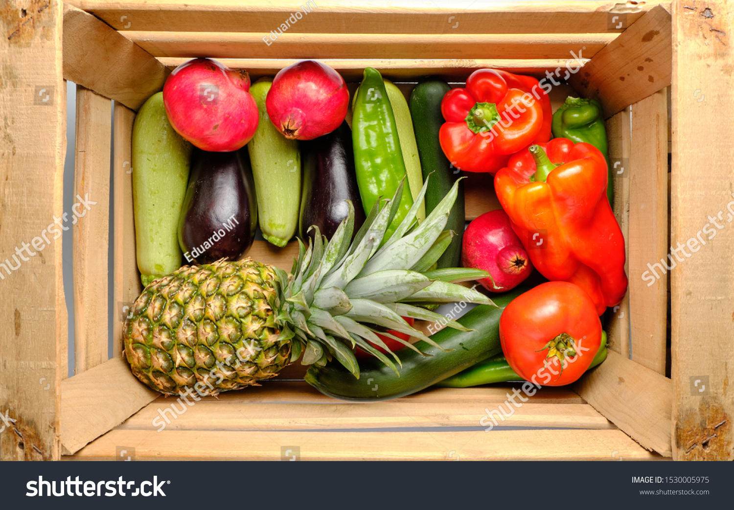 Old wooden box with freshly harvested vegetables and fresh fruits #1530005975