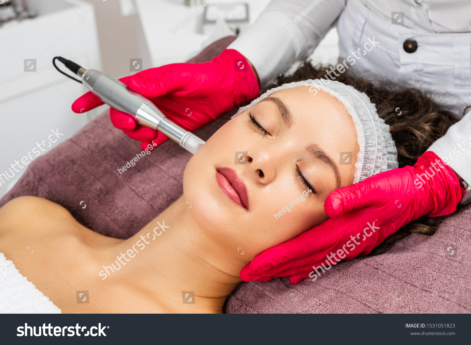 Beautiful woman receiving microneedling rejuvenation treatment. Mesotherapy.  #1531051823