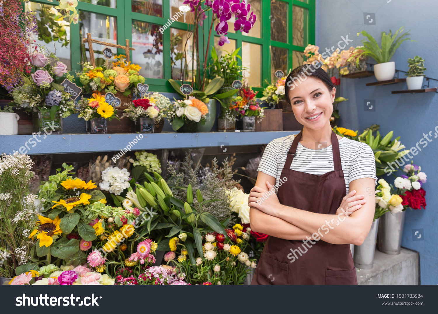 Startup successful sme small business entrepreneur owner asian woman standing with flowers at florist shop. Portrait of caucasian girl successful owner environment friendly concept with copy space #1531733984
