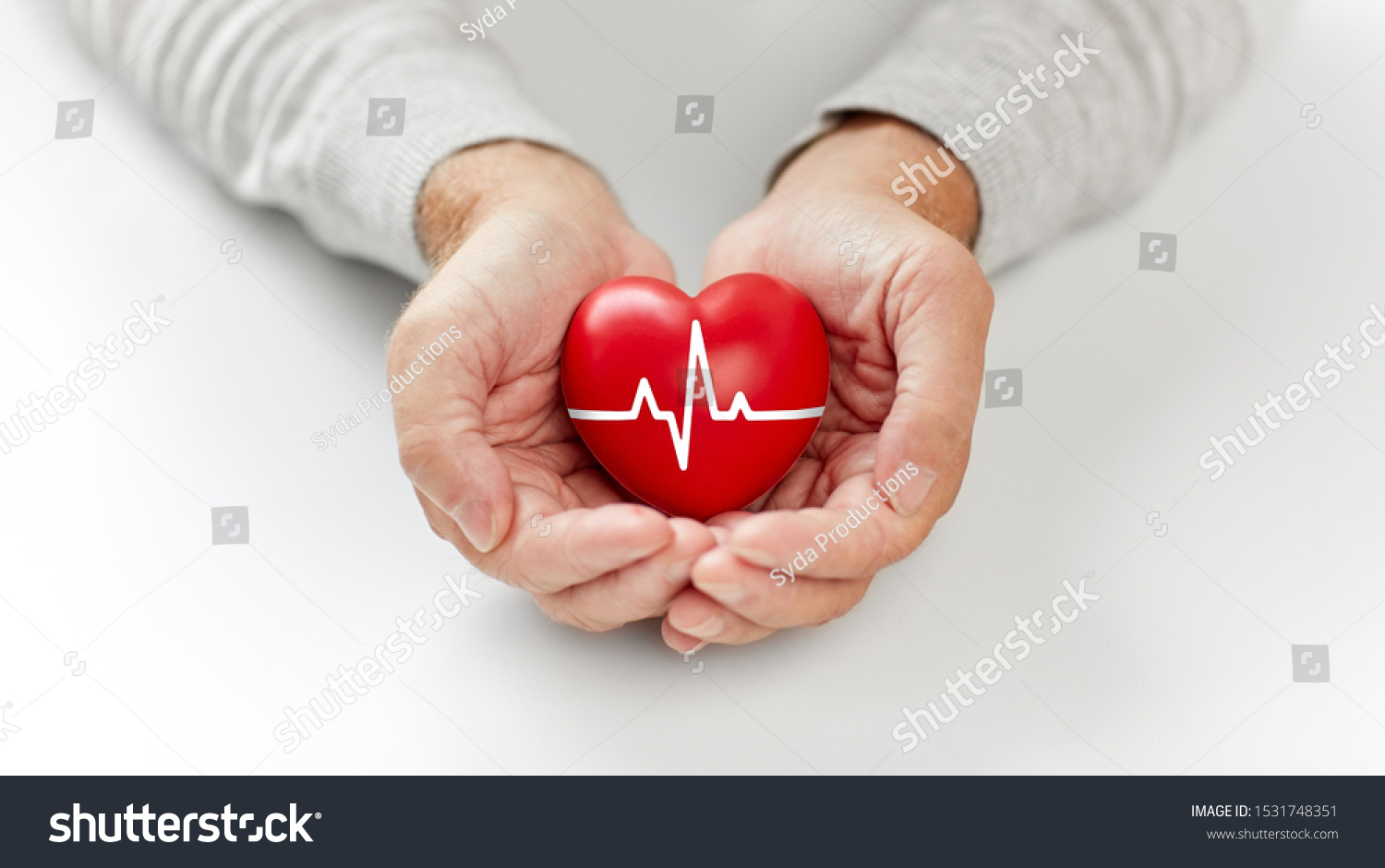 health, charity and people concept - close up of senior man holding red heart with ecg line in hands #1531748351