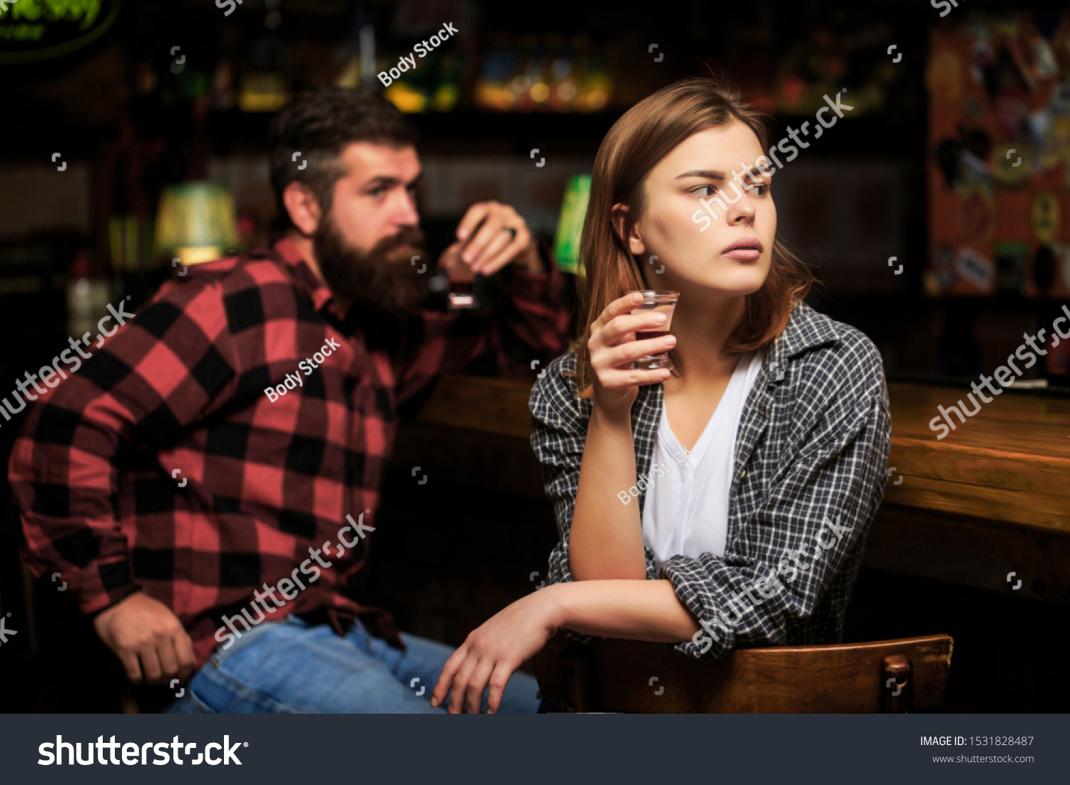 Female male alcoholism. Woman and man alcoholism. Woman alcoholic beverage in bar. Young woman has problems with alcohol. Alcoholism, alcohol addiction, male alcoholic. Young man drinking alcohol. #1531828487
