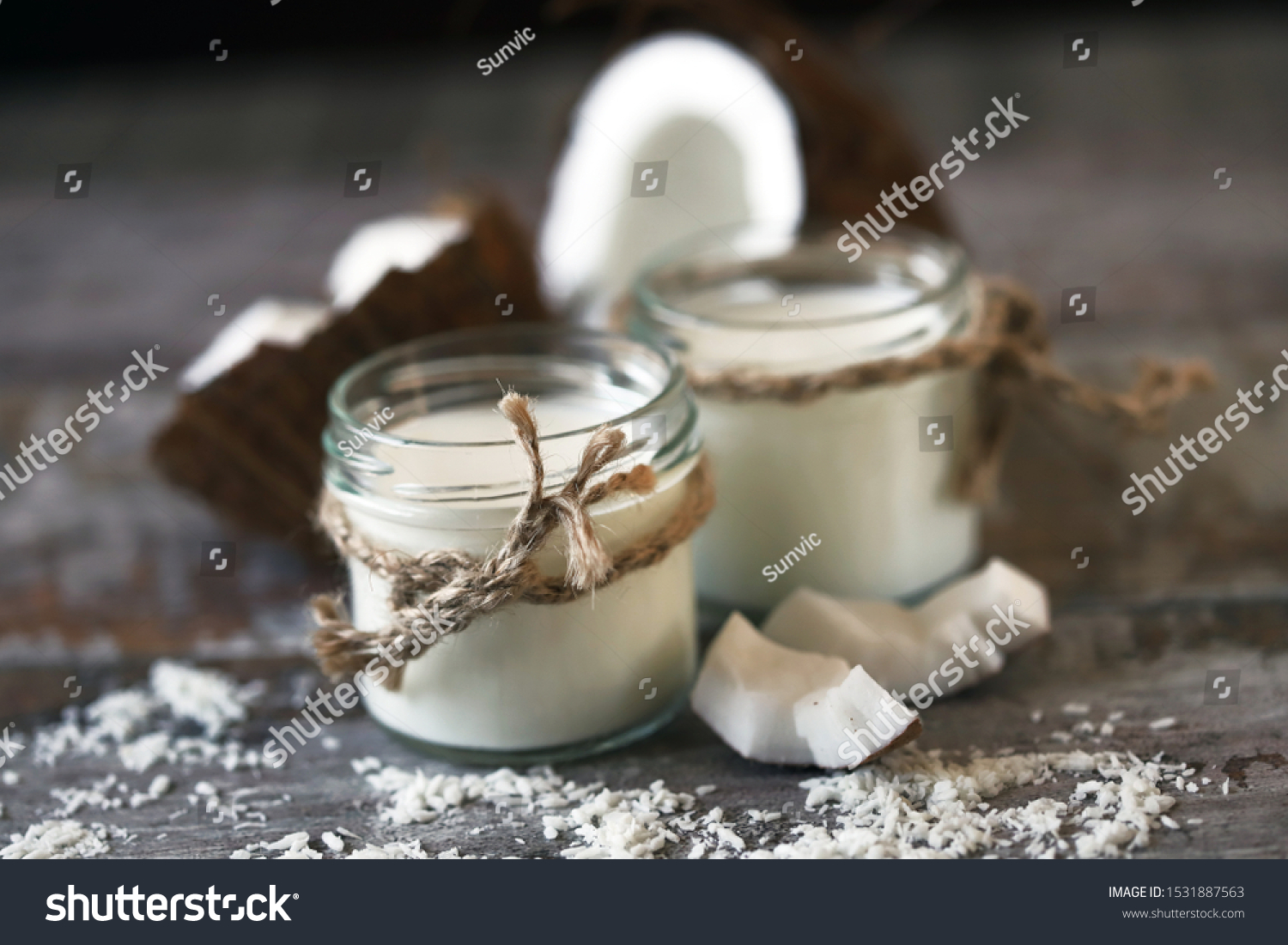 Keto diet. Keto drinks. Jars of coconut milk, coconut flakes, coconut. Coconut milk extraction. Vegan milk. #1531887563