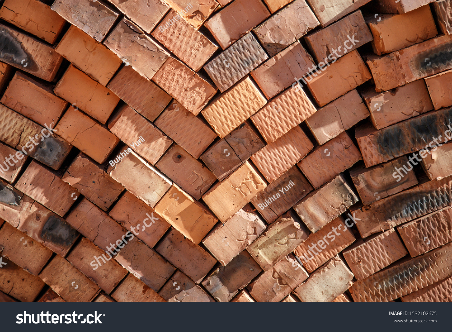 close-up of pack of orange clay bricks stands near the construction site. Clay brick is an ecological building material. #1532102675